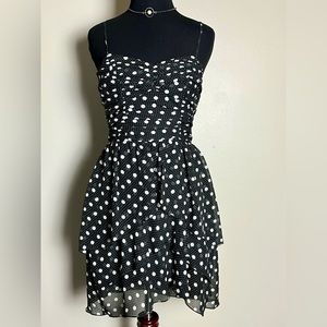 American rag black and white polka dot dress. Ruffled front .